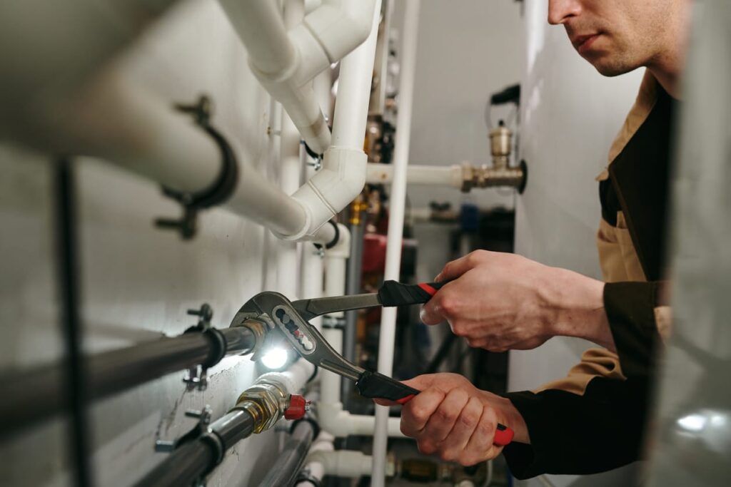 Plumbers maintaining commercial plumbing pipes in Brentwood