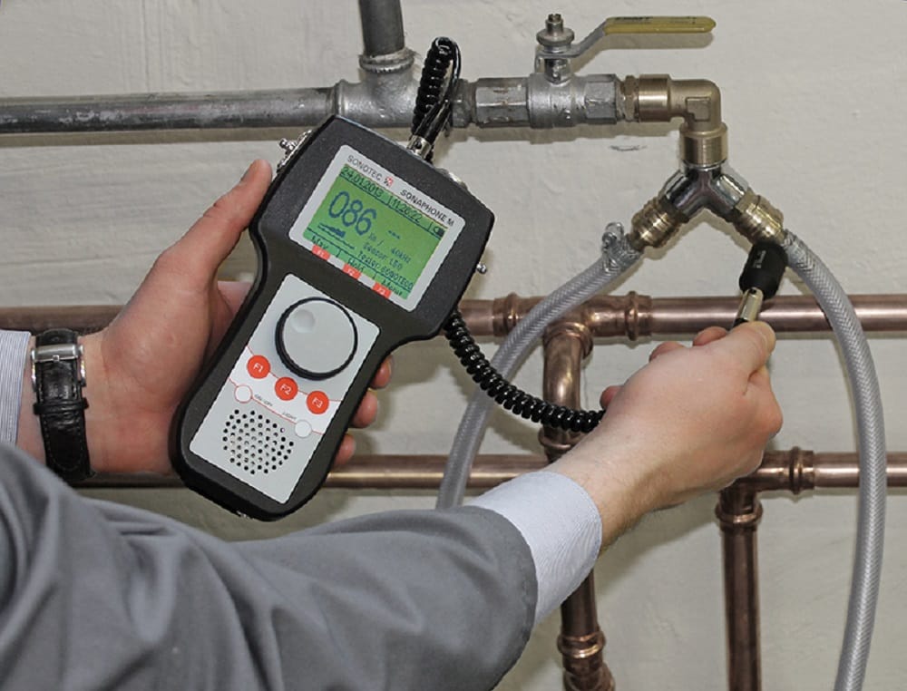 Plumber testing pipes with electronic leak detection equipment in Brentwood